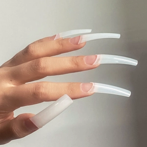 Side view of translucent milky white XXL extra long coffin shape nail tips on hand