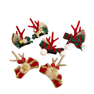 5-piece Christmas hair clip set with reindeer antlers and festive bows on white background