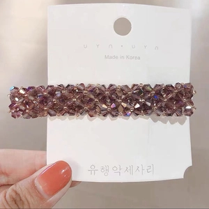 Detail of handmade lavender crystal beaded hair clip with silver metal base and glossy finish