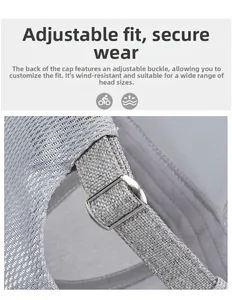 Detail of adjustable metal buckle and breathable mesh on light gray baseball cap