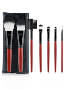 Detail of 7-piece makeup brush set with mahogany handles and black roll-up pouch