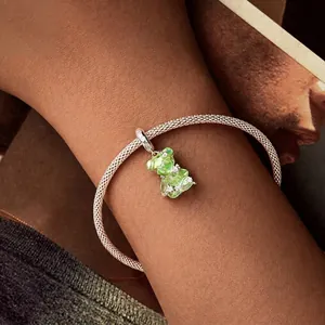 Elegant S925 silver mesh bracelet with a colorful gradient resin bear charm on a wrist