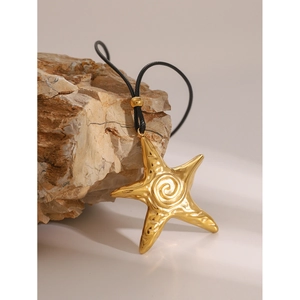 Vintage 18k gold starfish pendant with spiral texture on black wax cord necklace