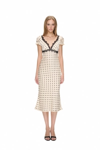 Detail of French vintage polka dot dress with black lace trim and puff sleeves