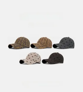 Detail showing tweed and embroidered bow baseball caps in brown, beige, and grey colors