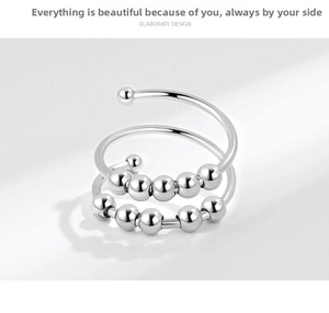 Detail view of double-layer fidget ring with spinning silver beads for anxiety relief
