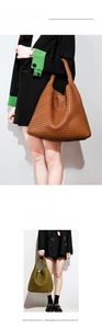 Close-up detail of large woven hobo shoulder bag showing cross-weave texture in caramel brown