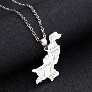 Macro shot of silver Pakistan map pendant on black leather showing engraved city details