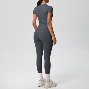 Rear view of seamless dark gray high-waist yoga pants and fitted sports top set