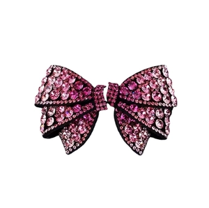 Elegant bow hair clip with pink rhinestones and black base for women's hairstyles