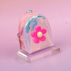 Detail of laser transparent mini coin purse with pink flower and iridescent finish
