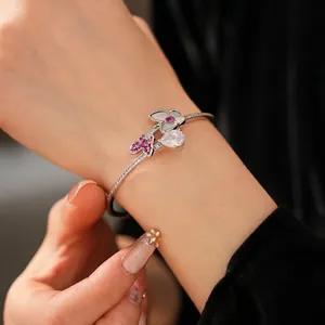 Exquisite silver open bangle featuring pink butterfly design and teardrop zircon accents