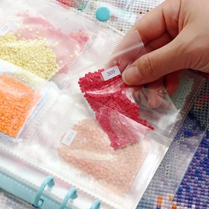 5D diamond painting storage book with labeled bags for organizing drills and beads