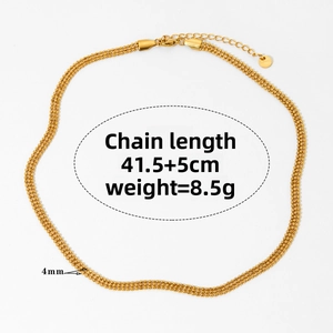 Detail view of a 3-strand gold ball chain necklace with lobster clasp and extension chain