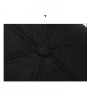 Detailed top view showing the six-panel stitching and central button of the wool baseball cap