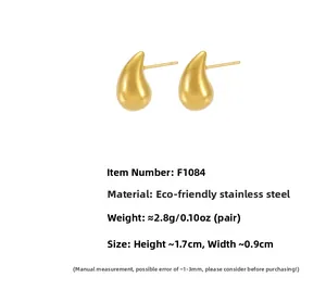 Macro shot of minimalist gold teardrop earrings in eco-friendly stainless steel