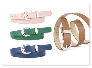 Detail view of colorful PU leather belts with polished silver oval buckles in four shades