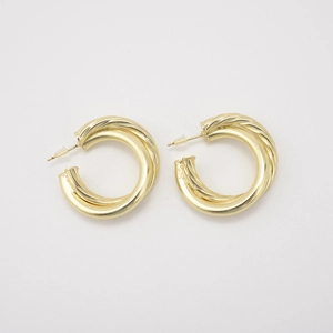 18k gold plated hollow twisted C-shaped earrings with a metallic finish on white background