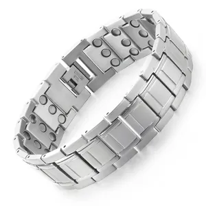 Detailed close-up of men's stainless steel magnetic link bracelet with polished finish