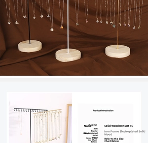 Macro view of T-bar jewelry stand with electroplated iron frame and solid wood base