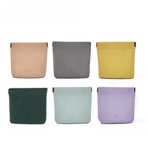 Detailed view of six colorful faux leather eyewear cases with metal squeeze closure