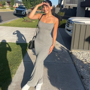 Detailed full-body view of a gray sleeveless bodycon maxi dress worn by a model outdoors
