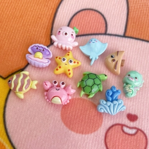 Macro view of colorful ocean cartoon resin accessories including crab, octopus, and starfish