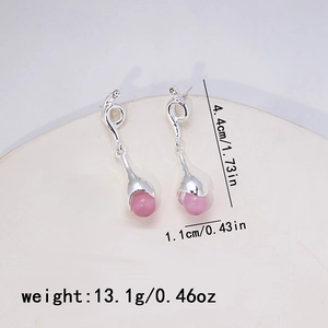 Detail view of silver drop earrings with pink beads showing dimensions and weight