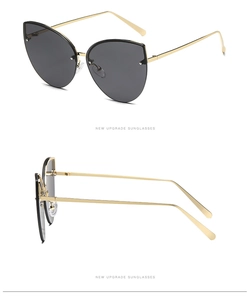 Detail of fashion cat-eye sunglasses with gold metal temples and soft silicone nose pads