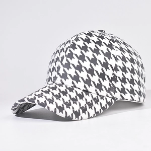 Classic black and white houndstooth baseball cap with a structured crown and curved brim