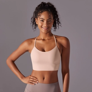 Detail of skin-pink racerback sports bra with seamless brushed fabric and thin straps