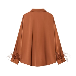 Caramel satin shirt for women with elegant feather trim cuffs and sleek glossy finish