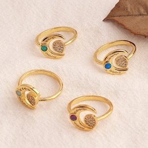 Vintage gold-plated star moon rings with natural stones and zircon on white linen