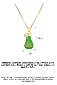 Detail of green teardrop pendant necklace with leaf zircon inlay and gold titanium chain