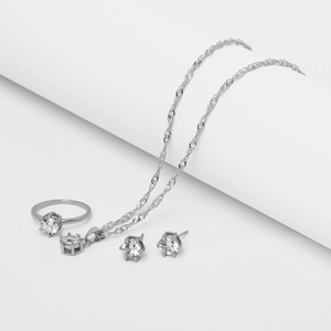 Classic silver jewelry set with necklace, ring, and earrings featuring round-cut zircons