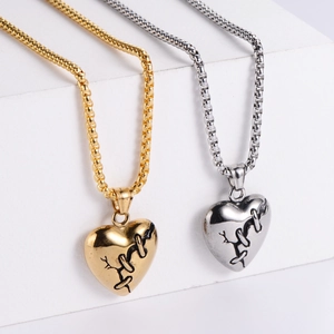 Trendy titanium steel heart pendants in gold and silver finish on geometric stands