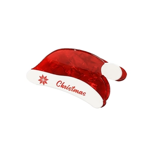 Christmas hat hair claw clip with festive red and white snowflake design on white backdrop