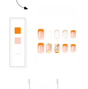Detail view of orange French press-on nails with wave patterns and golden glitter accents
