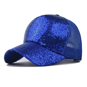 Detailed view of the bright blue sequins and breathable mesh fabric on the baseball cap
