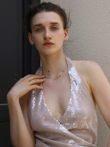 Close-up of a 18K gold plated stainless steel necklace with delicate heart-shaped pendants