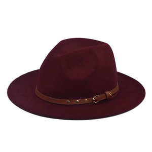 Detailed view of burgundy wool fedora with brown leather belt and metal buckle