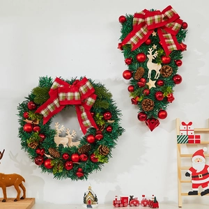 Classic Christmas wreath and teardrop swag set with red bows, pine cones and wooden reindeer