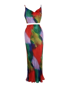 Detailed view of abstract print pleated fabric on two-piece vest and long skirt set