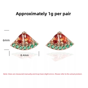 Detailed size view of rose gold watermelon stud earrings with red and green stones