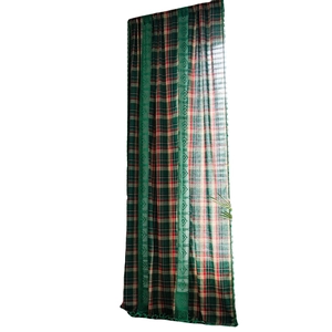 Red and green Christmas plaid curtain with vertical lace trim and decorative fringe