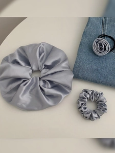Three-piece grey satin hair accessory set with scrunchies and a rose flower hair tie