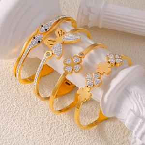 Elegant gold-plated titanium steel bangles with clover, butterfly, and snake designs