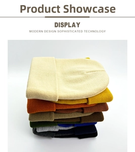 Detailed stack of multi-color knitted beanies showing fine texture and ribbed cuffs