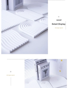 Macro shot of white wavy and arched plaster tray showing fine relief texture and detail