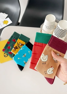 Set of five colorful cotton crew socks featuring strawberry, monkey, and bee jacquard patterns